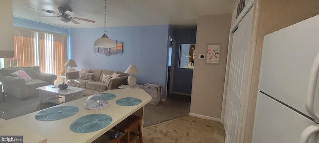 living room with light carpet and ceiling fan