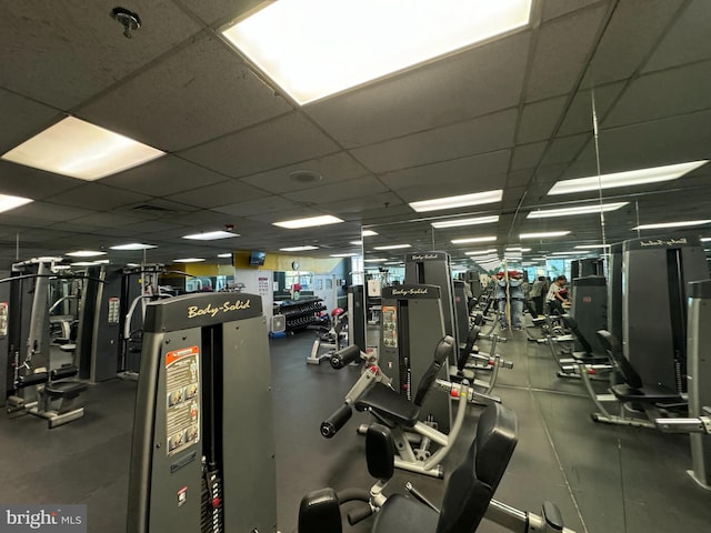 exercise room with a drop ceiling