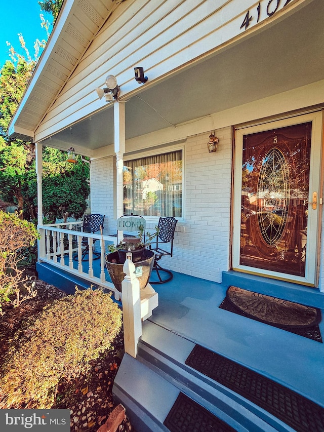 doorway to property featuring a porch