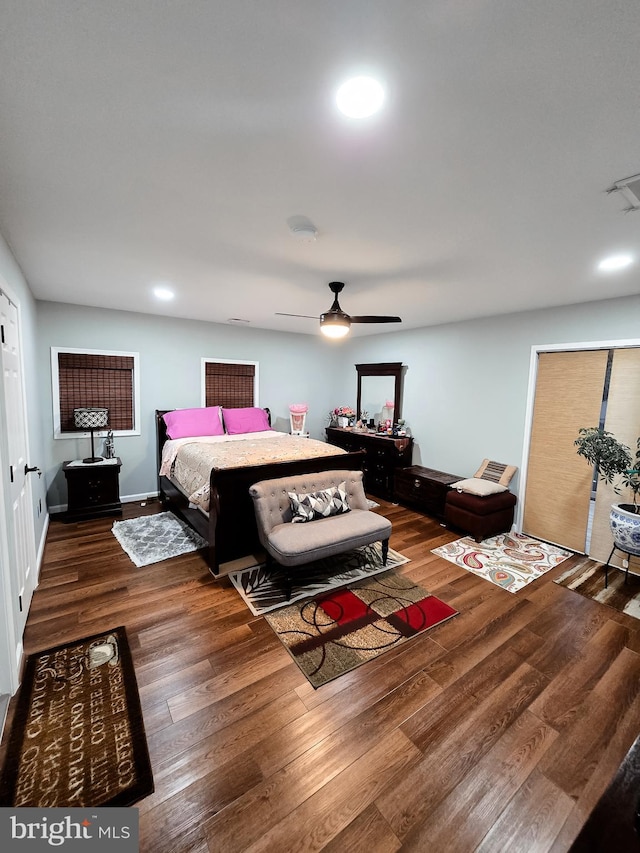 bedroom with dark wood-type flooring and ceiling fan