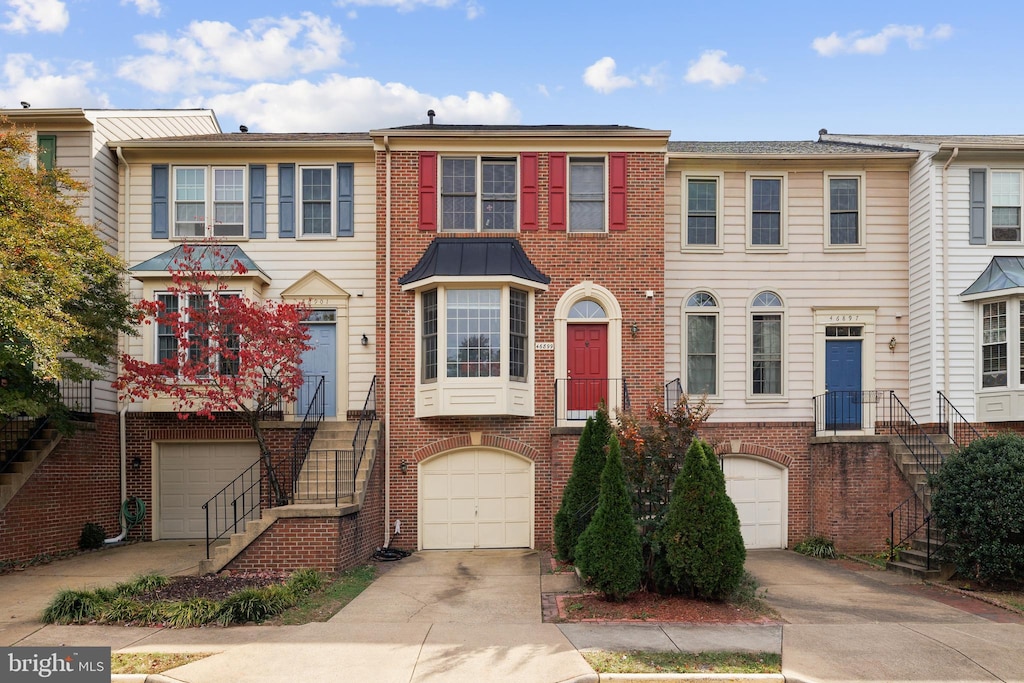 multi unit property featuring a garage