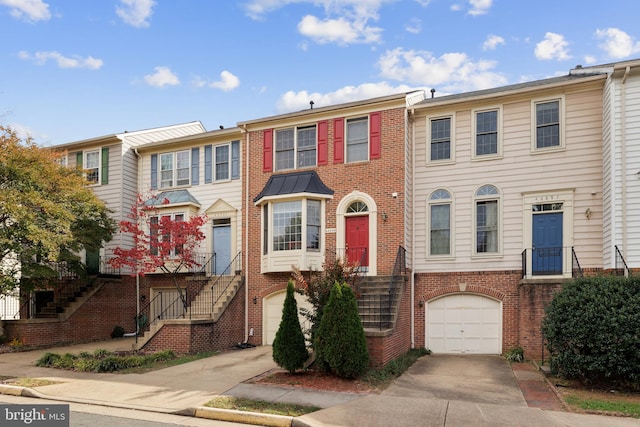 multi unit property featuring a garage