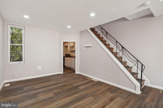 staircase featuring wood-type flooring