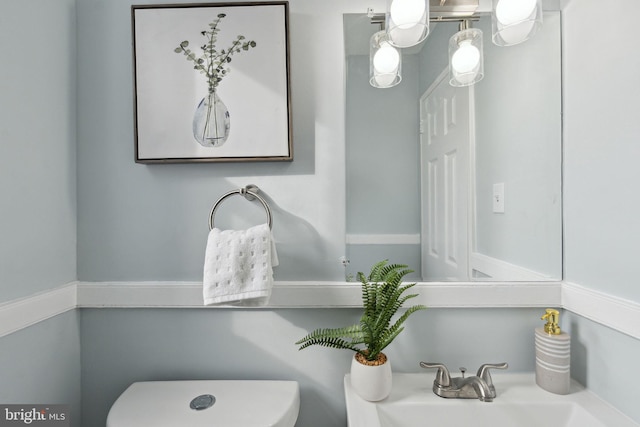 bathroom with toilet and sink