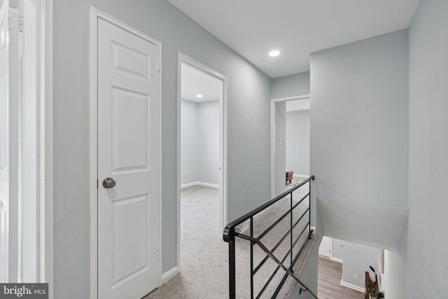 hallway featuring carpet flooring