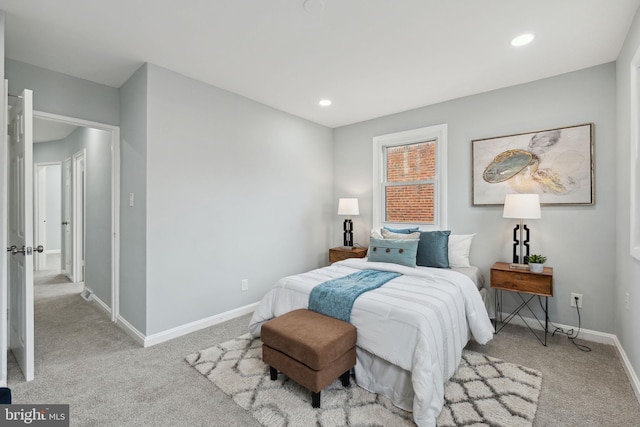 bedroom featuring light colored carpet