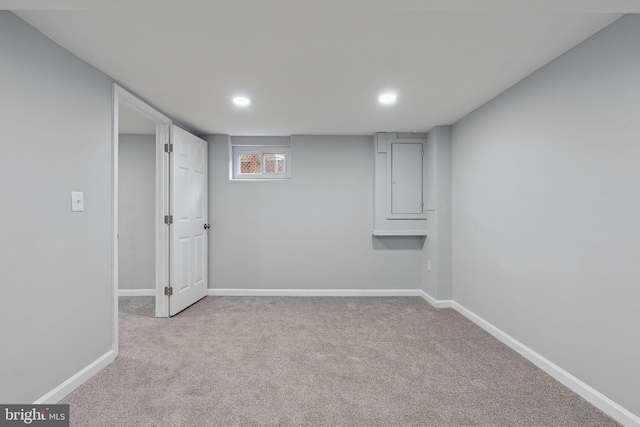 basement featuring light colored carpet