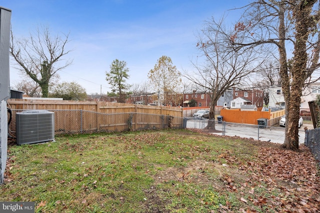 view of yard featuring central AC unit