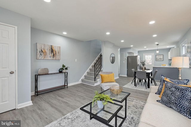 living room with light hardwood / wood-style floors