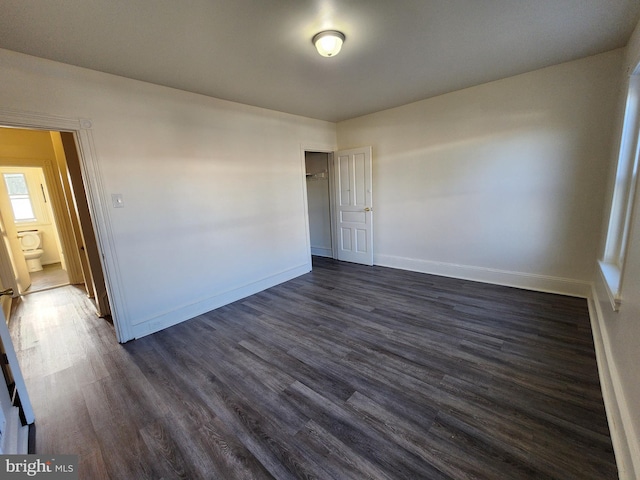 spare room featuring dark hardwood / wood-style floors