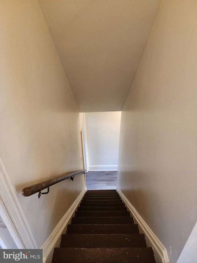 staircase featuring hardwood / wood-style floors