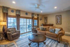 living room with ceiling fan