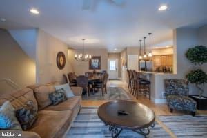 living room featuring an inviting chandelier