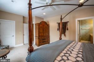 carpeted bedroom featuring connected bathroom