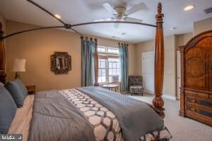 carpeted bedroom with ceiling fan