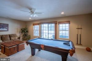 rec room with light carpet, billiards, and ceiling fan