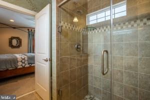 bathroom featuring tile patterned floors and walk in shower