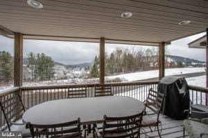 view of snow covered deck