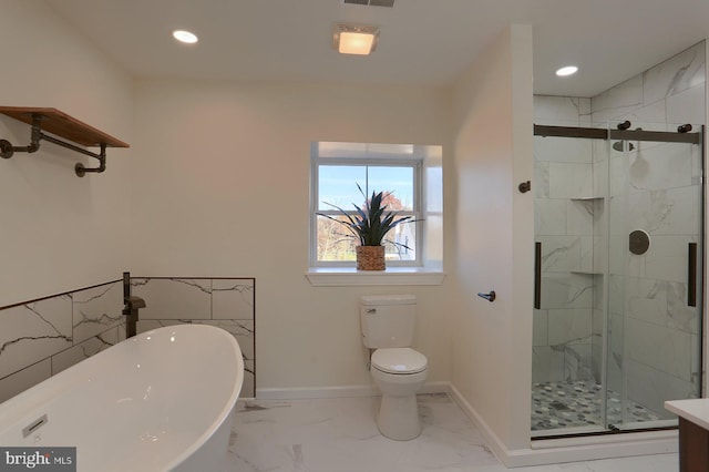 full bathroom featuring toilet, shower with separate bathtub, and vanity