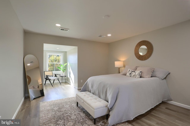 bedroom with hardwood / wood-style floors