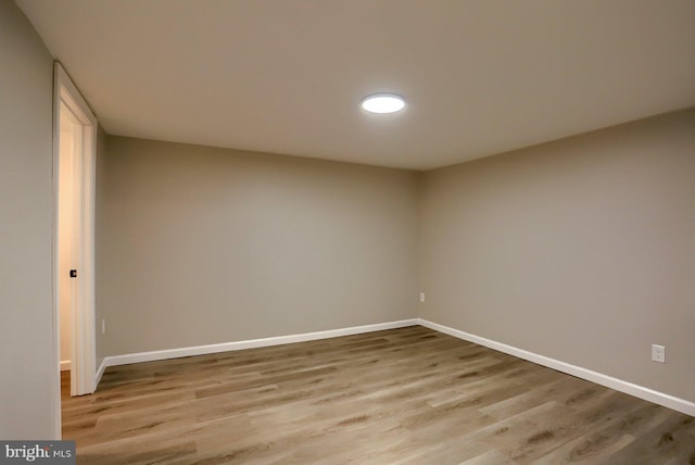 unfurnished room with light wood-type flooring