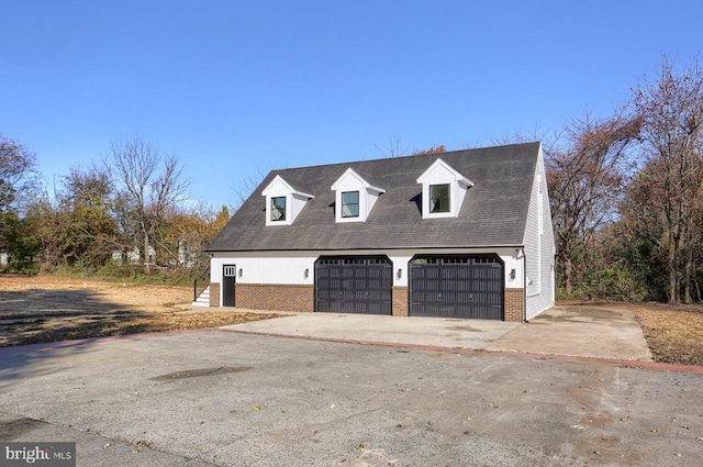 view of side of home featuring a garage