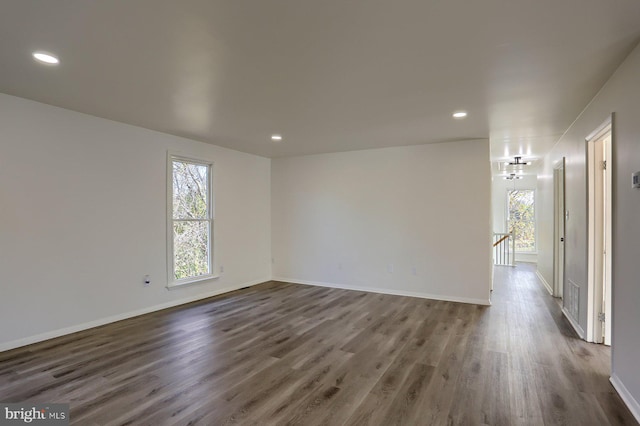 empty room featuring dark hardwood / wood-style flooring