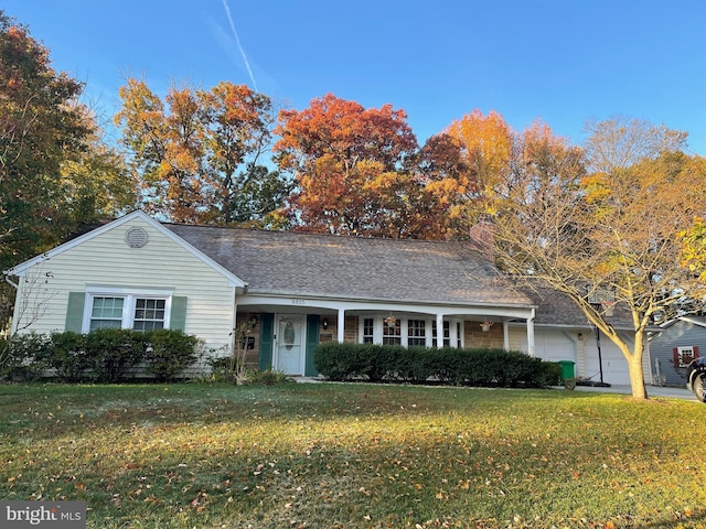 single story home with a garage and a front yard