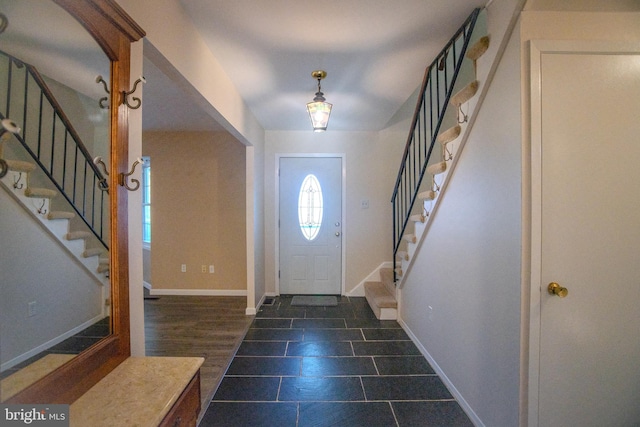 foyer with dark hardwood / wood-style floors