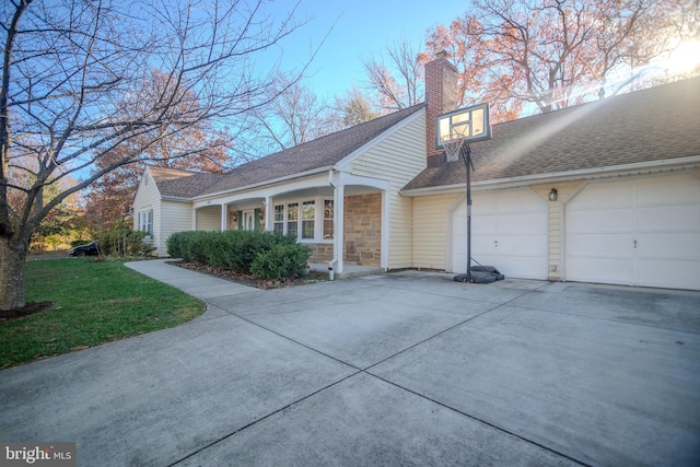 view of side of home featuring a garage