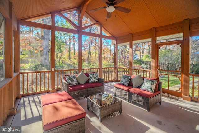 sunroom featuring vaulted ceiling with beams, ceiling fan, and wood ceiling