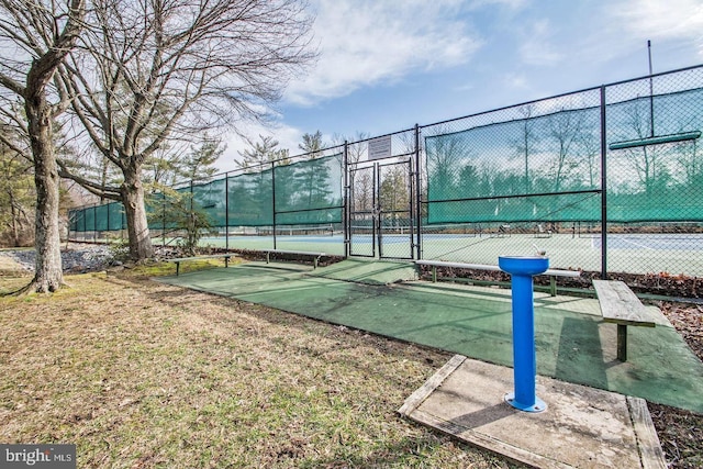 view of community with tennis court