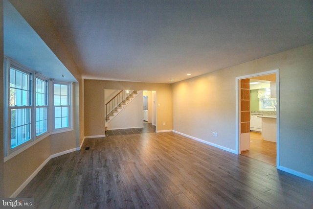 spare room with hardwood / wood-style floors