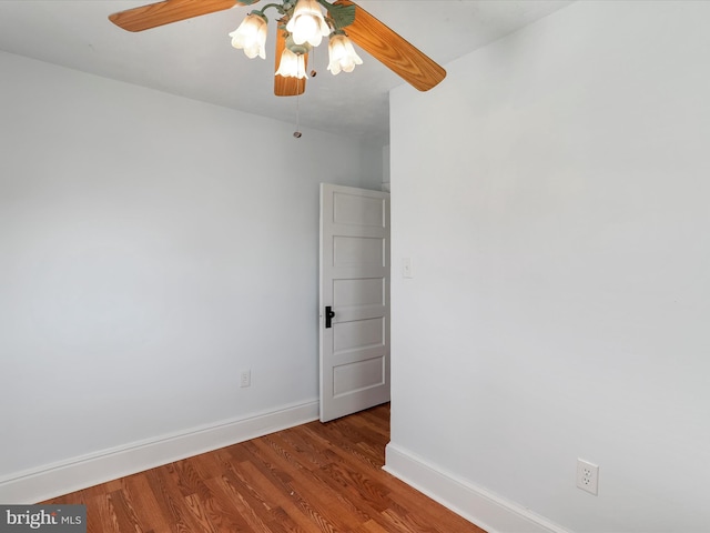 spare room featuring hardwood / wood-style floors and ceiling fan