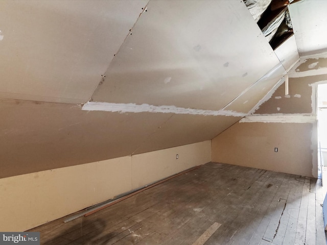 bonus room with lofted ceiling and hardwood / wood-style floors