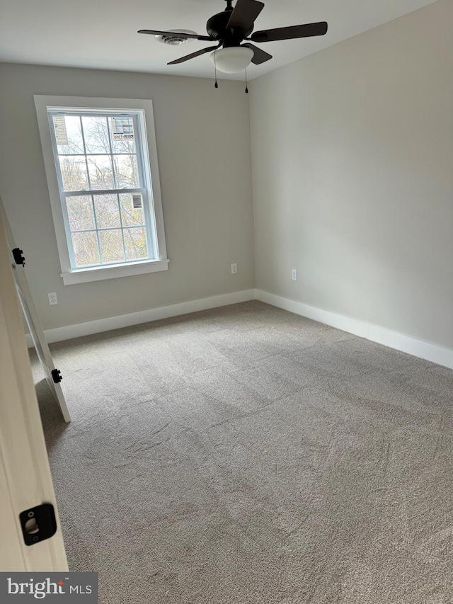 spare room with carpet flooring and ceiling fan