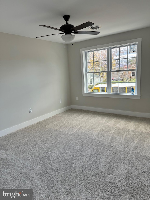 carpeted empty room with ceiling fan