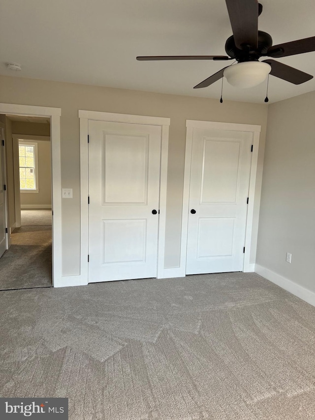 unfurnished bedroom with carpet flooring and ceiling fan