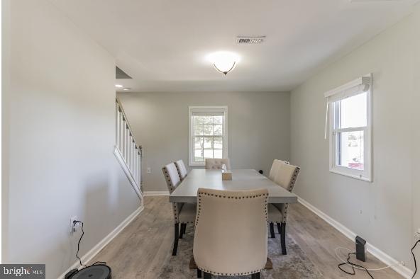 dining space featuring light hardwood / wood-style floors