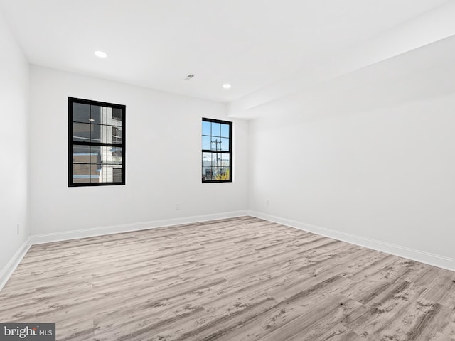 unfurnished room with light hardwood / wood-style floors