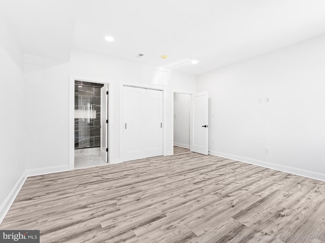 spare room with light wood-type flooring