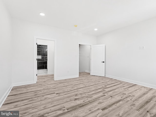 unfurnished bedroom featuring light wood-type flooring