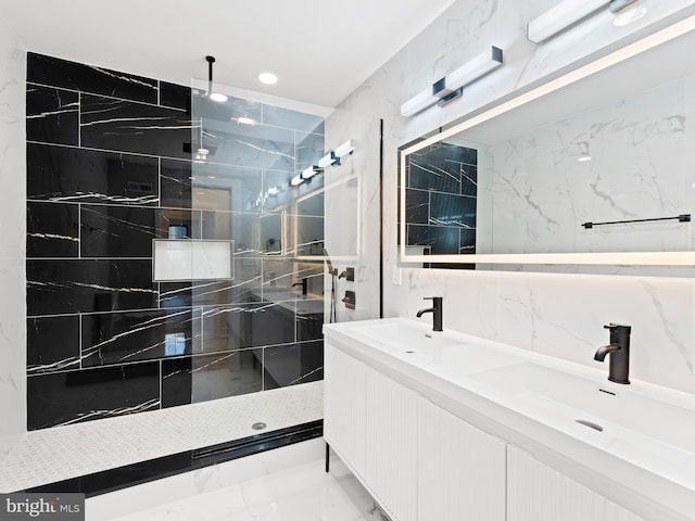 bathroom featuring vanity, tile walls, and tiled shower