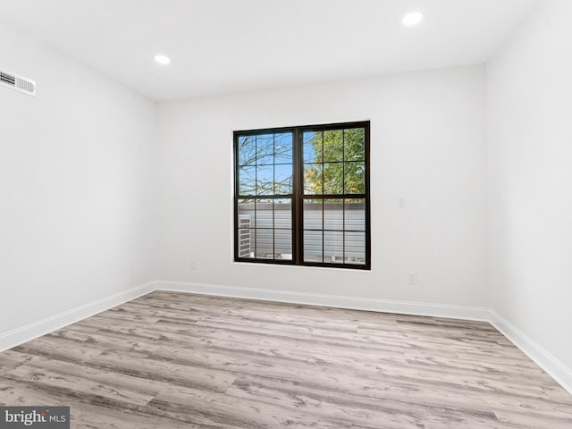 unfurnished room featuring light wood-type flooring