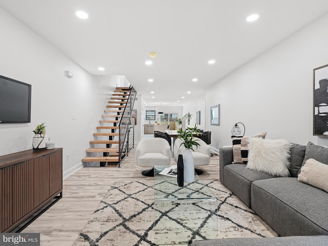 living room with light hardwood / wood-style flooring