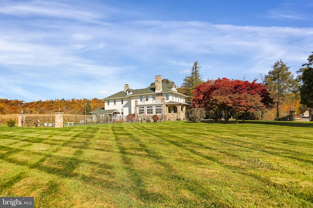 rear view of house with a lawn