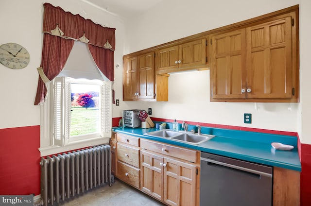 kitchen featuring stainless steel dishwasher, sink, and radiator heating unit