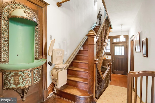 stairway with wood-type flooring