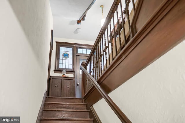 stairs featuring track lighting