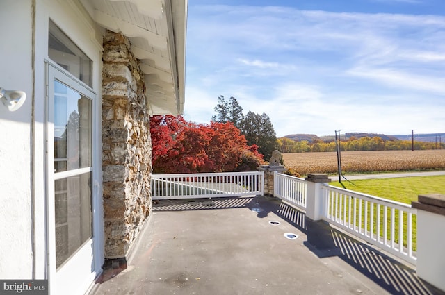 view of patio / terrace with a rural view